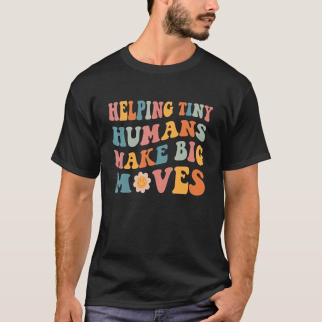 Camiseta Ajudar os pequenos humanos a fazer grandes movimen (Frente)