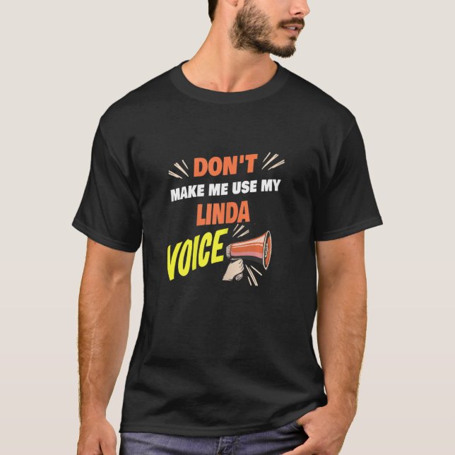 Camiseta As mulheres não me fazem usar minha voz de Linda. (Frente)