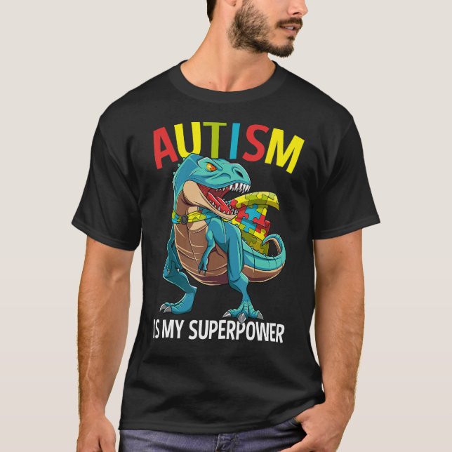Camiseta Autismo É Meu Super Poder Dinossauro Quebra-cabeça (Frente)