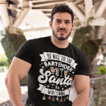 Camiseta Be nice to the bartender Santa is watching fun<br><div class="desc">Remind the customers of your bar to stay on the nice list this year with this fun Christmas t-shirt featuring the wording "Be nice to the bartender, Santa is watching" in white modern fonts, decorated with red, green and yellow Christmas lights, black snowflakes, a red Santa hat, and some colorful...</div>