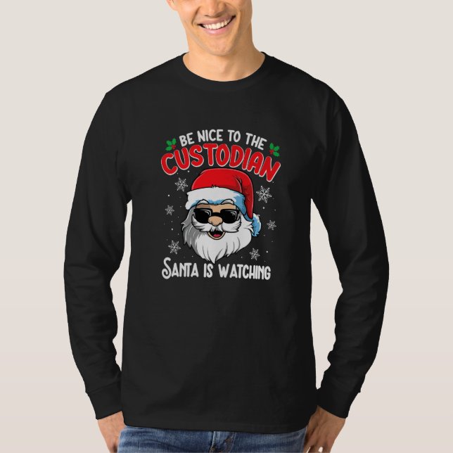 Camiseta Be Nice To The Custodian Santa Is Watching  Christ (Frente)