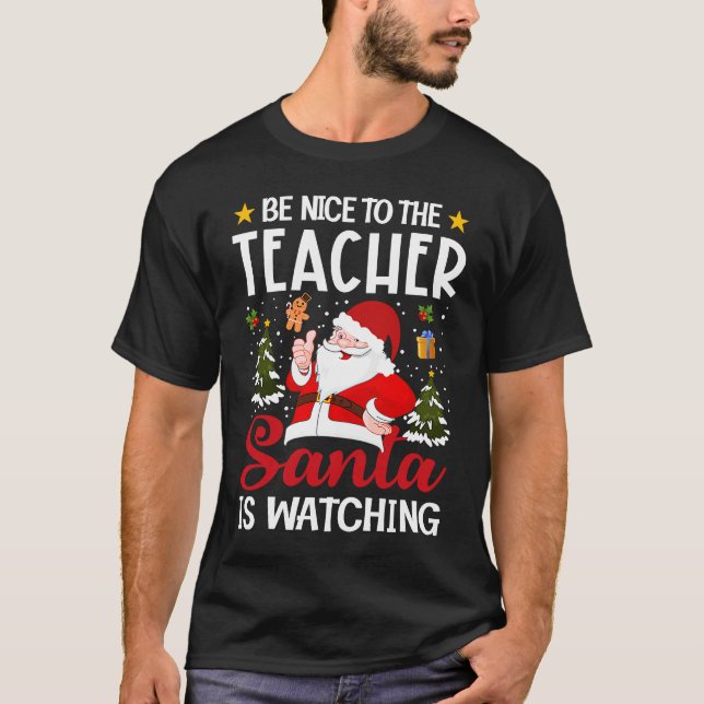 Camiseta Be Nice To The Teacher Santa Is Watching Teacher C (Frente)