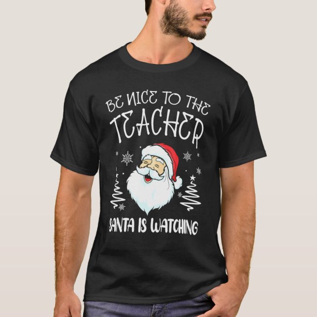 Camiseta Be Nice To The Teacher Santa Is Watching Teacher C (Frente)