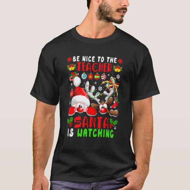 Camiseta Be Nice To The Teacher Santa Is Watching Xmas Sant (Frente)