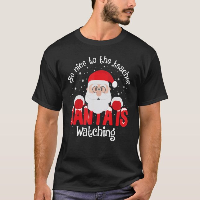 Camiseta Be Nice To The Teacher Santa Is Watching Xmas Teac (Frente)