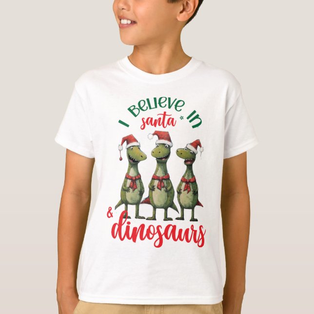 Camiseta Bom Natal Acredito em Papais noeis e Dinossauros (Frente)