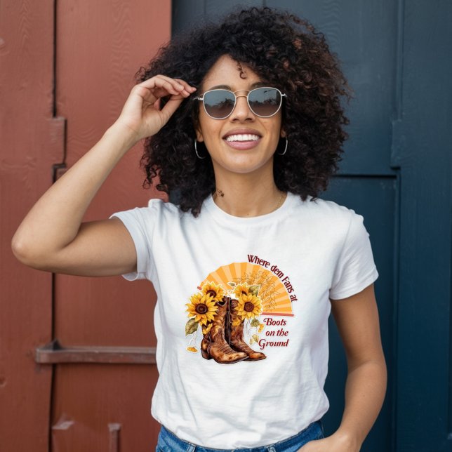Camiseta Boots no chão onde os ventiladores de dem são colo (Criador carregado)