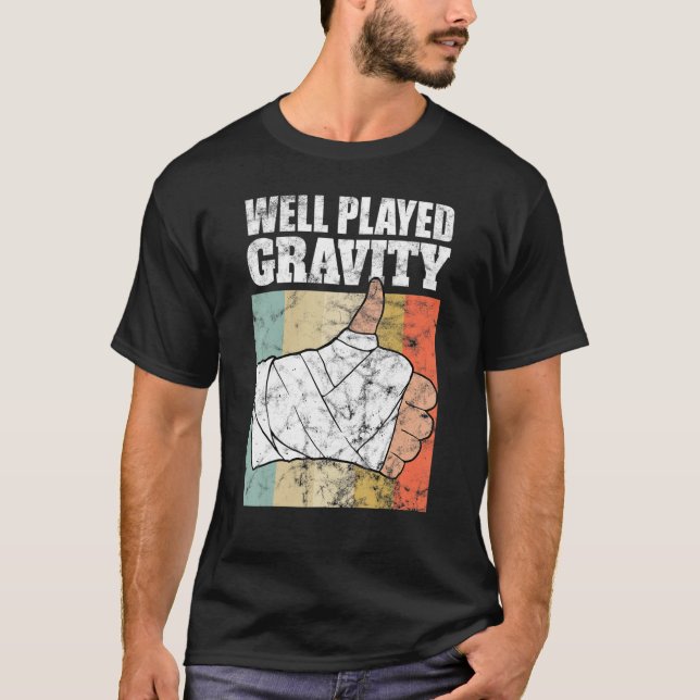 Camiseta Braço Quebrado Bem Tocado Gravidade (Frente)
