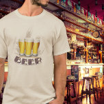 Camiseta Cerveja T-Shirt<br><div class="desc">Uma camiseta de cerveja simples para o amante da cerveja em você! Três copos de cerveja sentam-se na frente dos ouvidos de trigo com a palavra cerveja em negrito na parte inferior.</div>