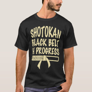 Camiseta Cinturão preto Shotokan em andamento, citação dize