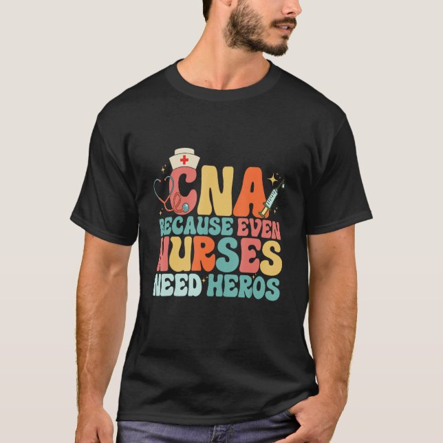 Camiseta CNA Humor Because Even Nurses Need Heroes  Nurse T (Frente)
