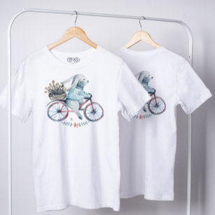 Camiseta Coelhinho de Páscoa bonito em uma bicicleta
