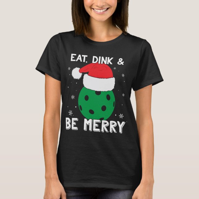 Camiseta Coma Dink E Seja Feliz Pickleball Santa Hat Engraç (Frente)