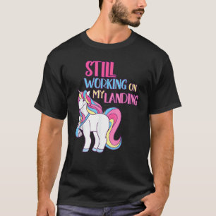 Camiseta Continuando Trabalhando Em Minha Aterrissagem Feri