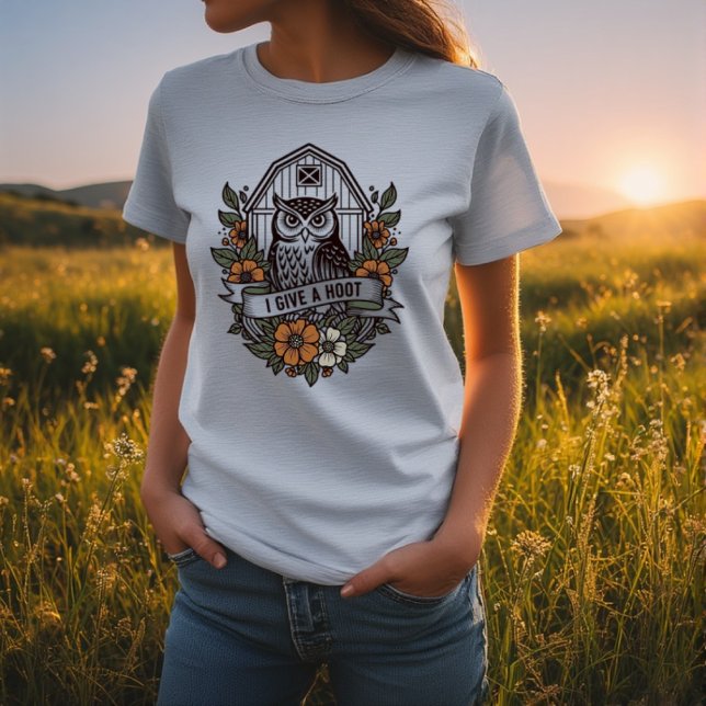 Camiseta Coruja retrô 'Eu dou uma design (Retro barn owl 'I give a hoot' design T-Shirt
A wise old barn owl who gives a hoot from the heart an)
