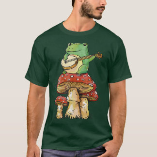 Camiseta cottagecore sapo de moagem de fada sobre cogumelos