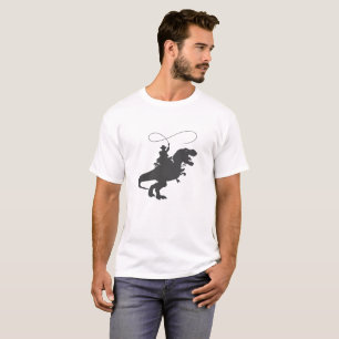 Camiseta Cowboy cavalgando dinossauro na era pré-históric