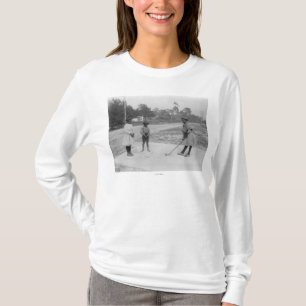 Camiseta Crianças pretas que jogam a fotografia do golfe