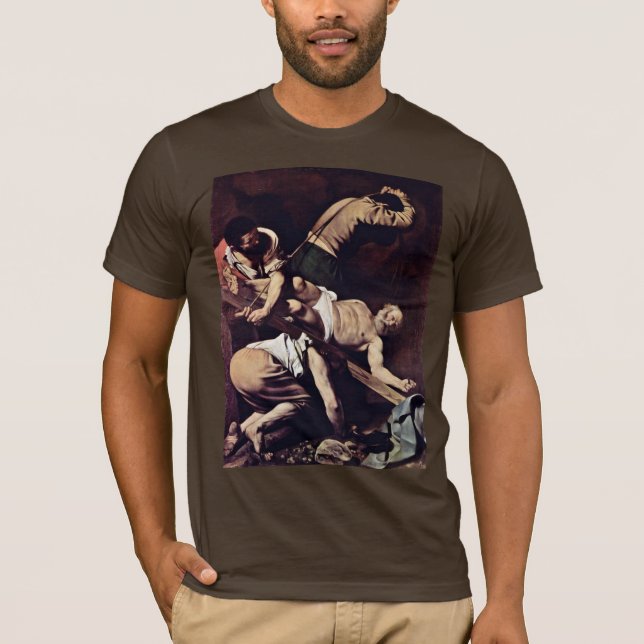 Camiseta Crucificação de St Peter por Michelangelo Merisi a (Frente)