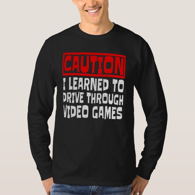 Camiseta Cuidado Eu Aprendi a Dirigir Através de Jogos de V (Frente)