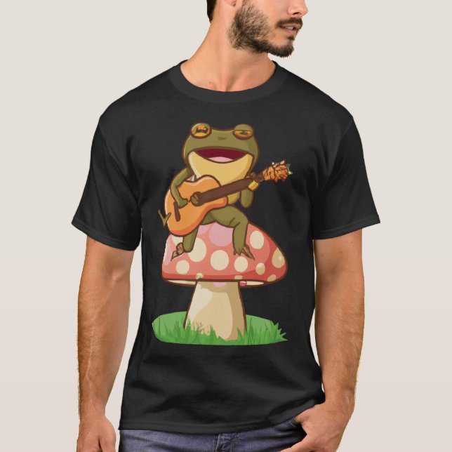Camiseta Cute Japanese frog playing guitar banjo on a mushr (Frente)