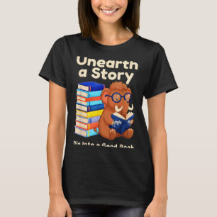 Camiseta Desvendar uma história lendo livro pré-histórico d