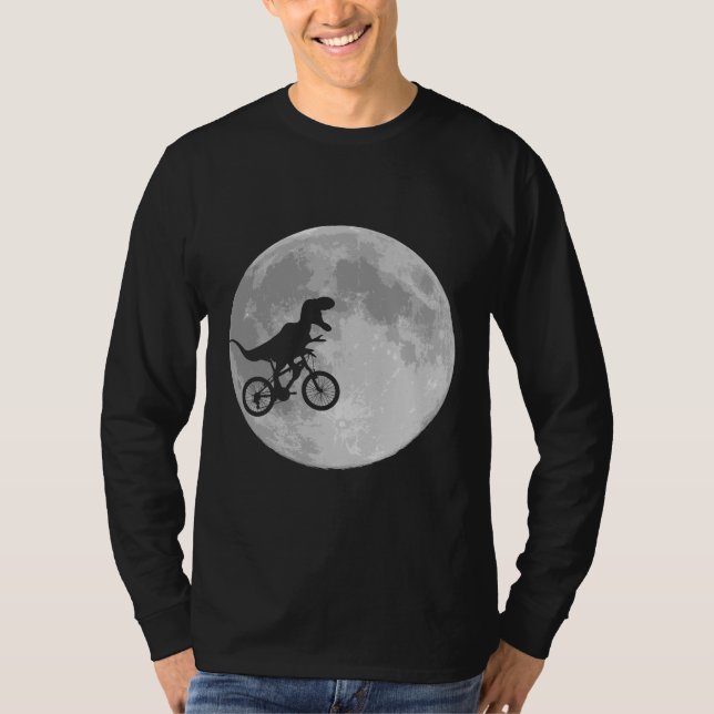 Camiseta Dinossauro em bicicleta no céu com lua (Frente)