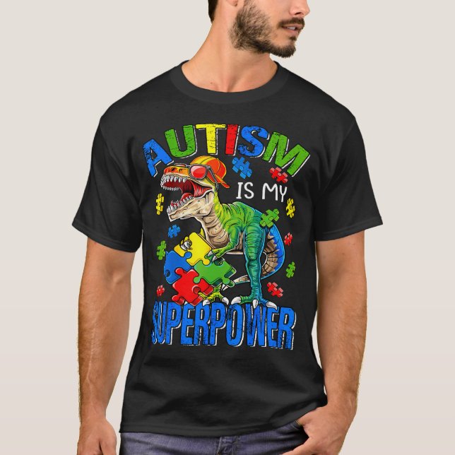 Camiseta Dinossauro Rex Autismo É Meu Autismo Superpoderoso (Frente)