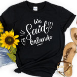 Camiseta Dissemos Orlando Black Funny Bachelorette<br><div class="desc">Um design moderno bonito para a festa de casamento ou para uma solteira se livrar. Dissemos a Nova Iorque Orlanda "em uma tenda preta, tem coração e deve ser notado. Destino da festa de solteira... Orlando. Podem ser vestidos para janto de ensaio, e juntamente com a sua festa de casamento....</div>