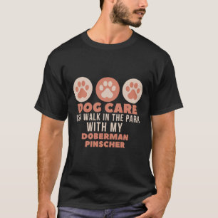 Camiseta Dog Care Is Walk In The Park With My Doberman Pins