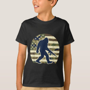 Camiseta Dono de arma Bigfoot camuflado na bandeira america