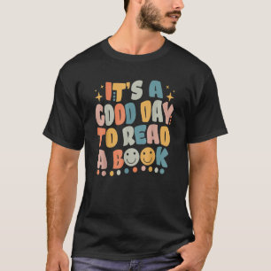 Camiseta É um bom dia ler a biblioteca de livros