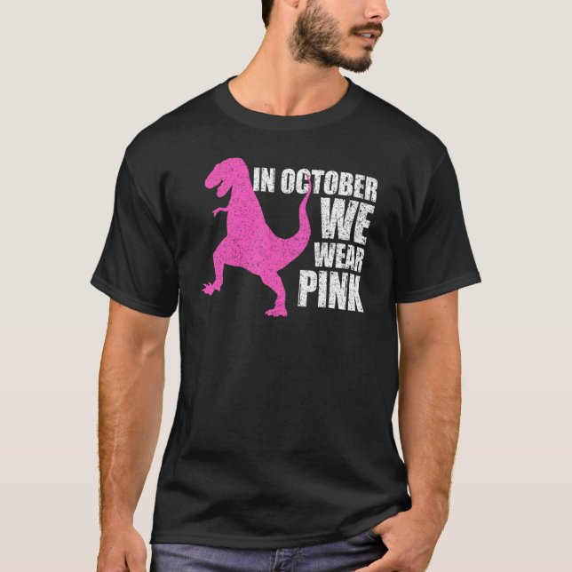 Camiseta Em outubro Vestimos Dinossauro Rosa (Frente)