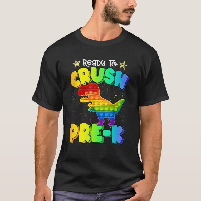 Camiseta Esmagar Pré K Dinossauro Pop It Fidget Volta às Au (Frente)