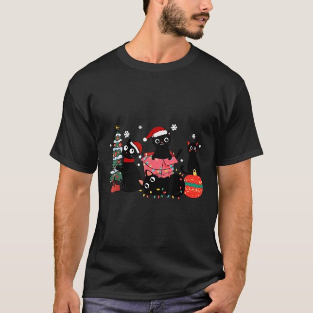 Camiseta Feliz Natal Gatos Pretos Brincam Luzes da Árvore d (Frente)