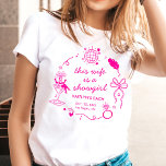 Camiseta Festa de Despedida de Solteira Desta Mulher, Uma G<br><div class="desc">Prepare-se para trocar as penas por um véu! Celebre a noiva com este personalizado t-shirt de despedida de solteira ao estilo de Las Vegas! Com uma ilustração elegante e retrô de uma corista em um copo de martini, bola de discoteca e um laço caprichoso, este design captura o brilho e...</div>