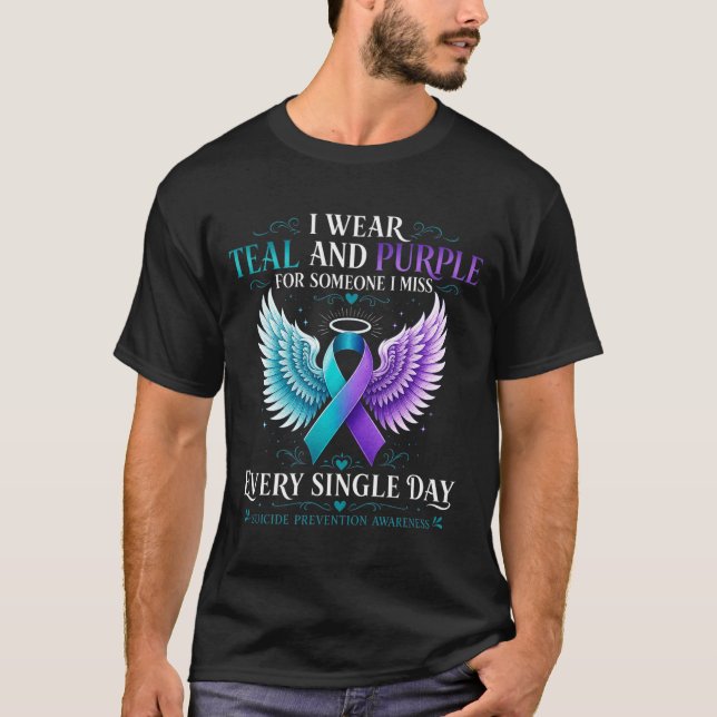 Camiseta Fita de conscientização azul-turquesa e roxa com a (Frente)