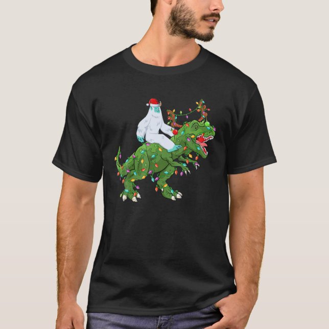 Camiseta Funny Xmas Lights Santa Yeti Riding Dinosaur Trex (Frente)