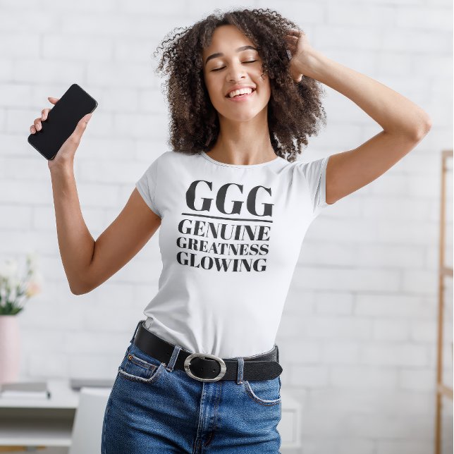 Camiseta GG- Genuína, Grande, Brilhante (Young woman dances in "GGG: Genuine, Greatness, Glowing" white t-shirt.)