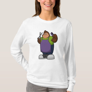Camiseta Gorila como cabeceira com tesoura e pente
