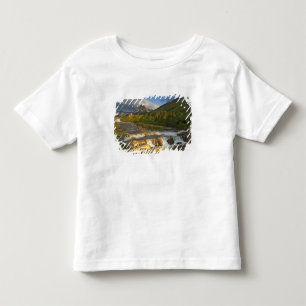 Camiseta Infantil A luz da manhã saúda Swiftcurrent Falls no
