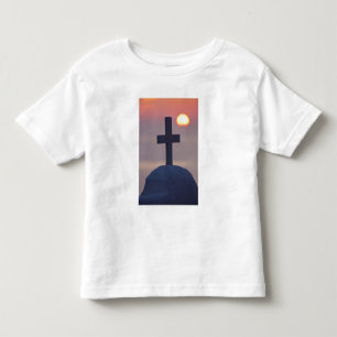Camiseta Infantil Cruz no topo de uma igreja ao pôr do sol, Mykonos,