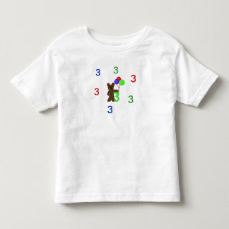 Camiseta Infantil Estou Três Com um Ursinho de Pelúcia e Balões
