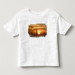 Camiseta Infantil EUA. Califórnia. São Francisco. Sol se pondo