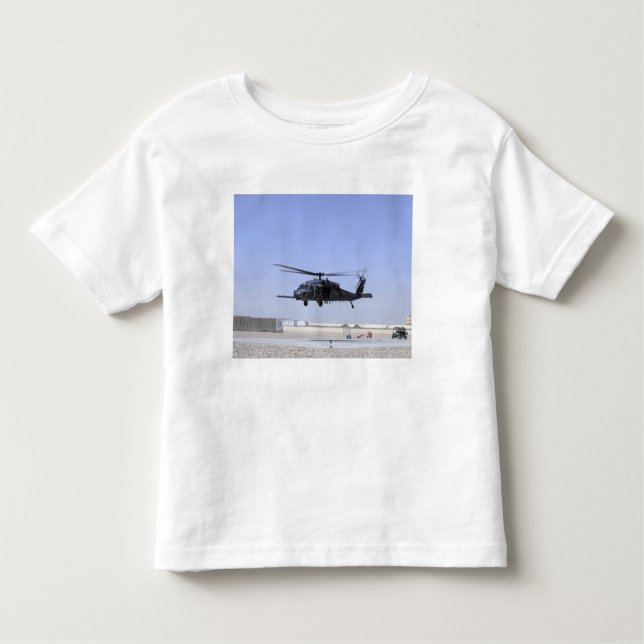 Camiseta Infantil HH-60G Pave Hawk decolando de Camp Bastio (Frente)