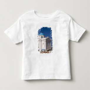 Camiseta Infantil Igreja branca na praia perto do Mar Egeu em