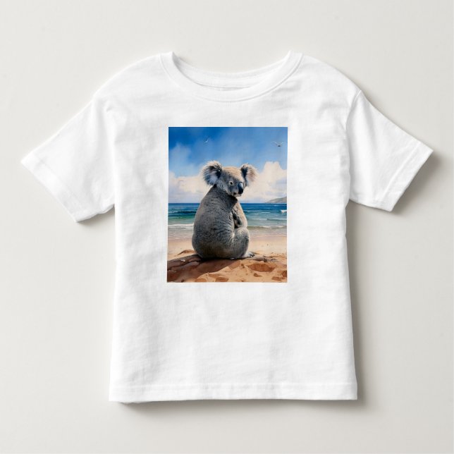 Camiseta Infantil Koala em uma praia arenosa (Frente)