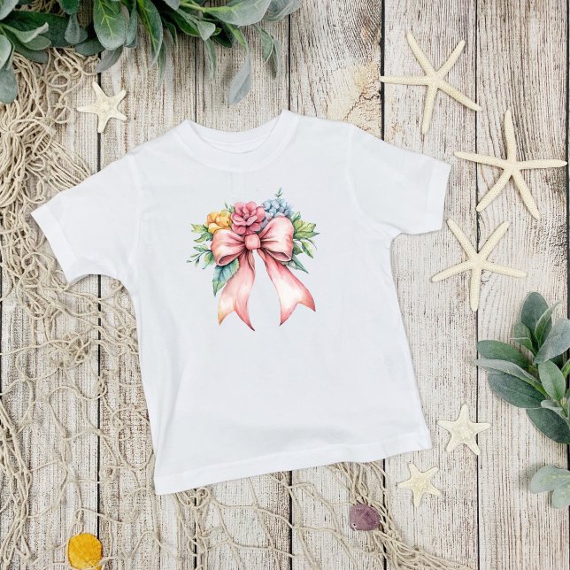 Camiseta Infantil Laços Rosa Florais Aquarela Meninas Fofas (Pink bow with watercolor florals, coquette aesthetic, Toddler Girls T-shirt)