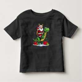 Camiseta Infantil Lustiger Weihnachtsmann auf Dino mit Lichterkette