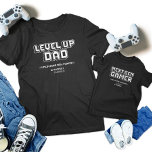 Camiseta Infantil Nível para Cima Pai do Jogador Filha Próxima Geraç<br><div class="desc">Celebre o melhor vínculo de jogos com nossas t-shirts correspondentes ao "Pai para jogadores e próximo jogador de gen"! Com designs retrorados "Pai de Nível Superior" e "Jogador de Próxima Geração", estas camisas são perfeitas para Dia de os pais, aniversários ou qualquer evento de jogos. Mostre sua paixão compartilhada com...</div>